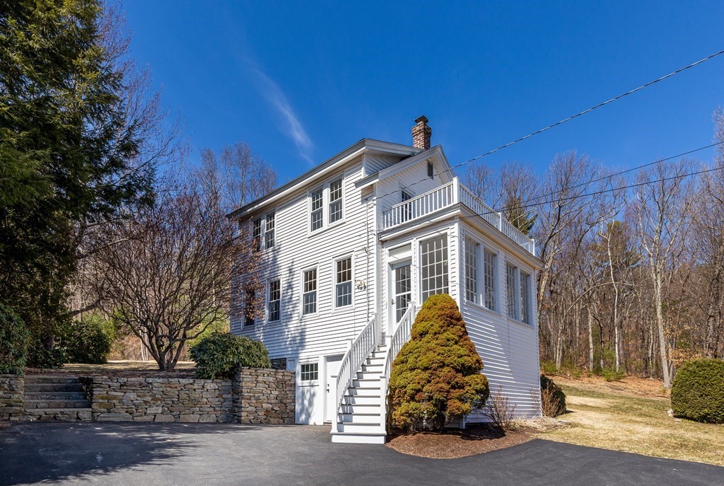 61 Ayer Road Harvard, MA 01451 - Photo 1 of 32 a front view of a house with a yard