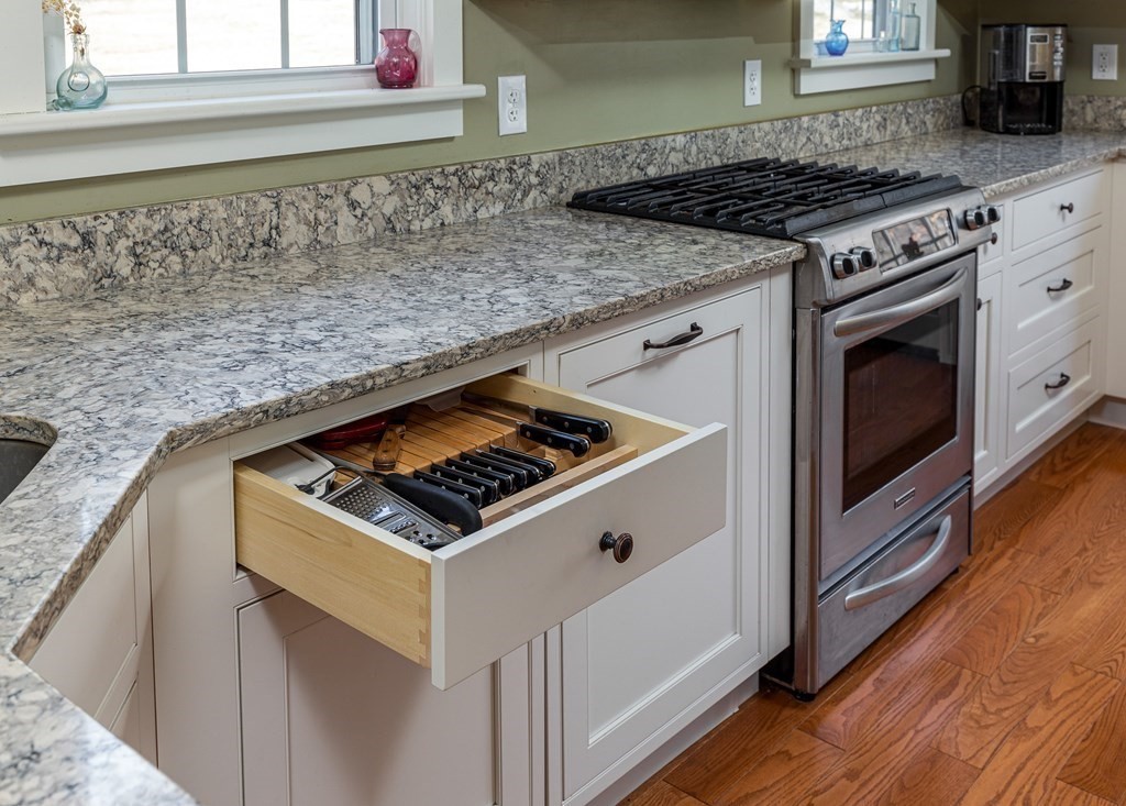 61 Ayer Road Harvard, MA 01451 - Photo 17 of 32 a white stove top oven sitting inside of a kitchen