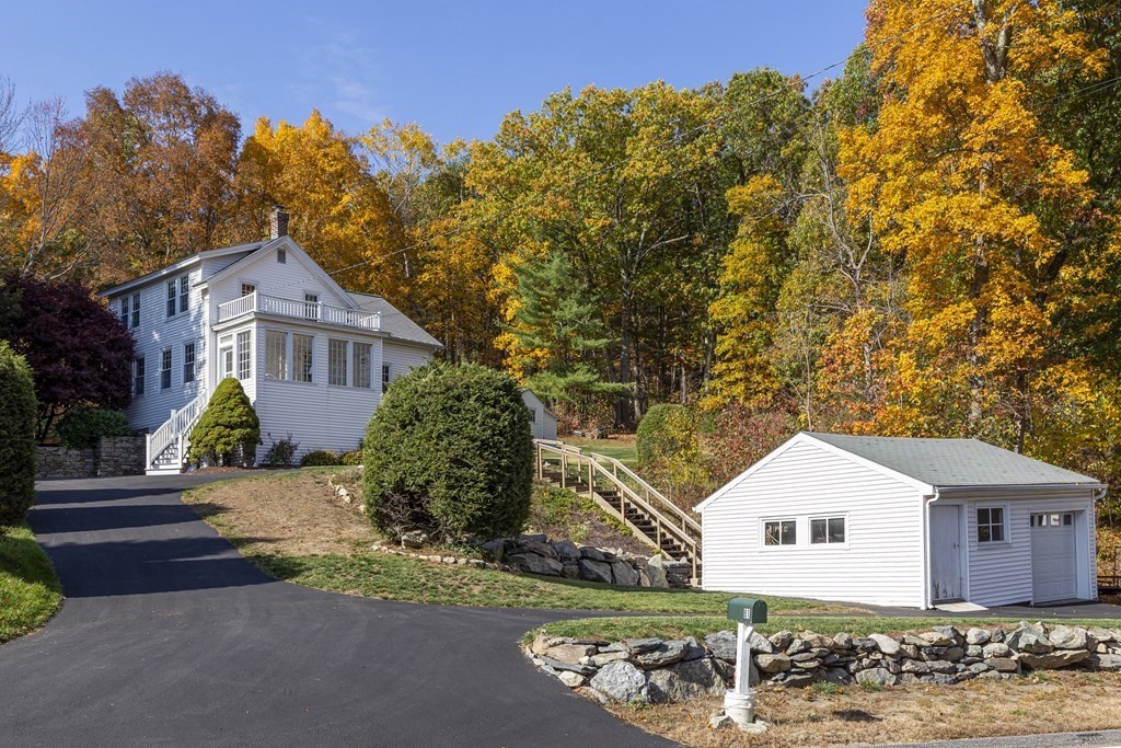 61 Ayer Road Harvard, MA 01451 - Photo 2 of 32 a front view of a house with a garden
