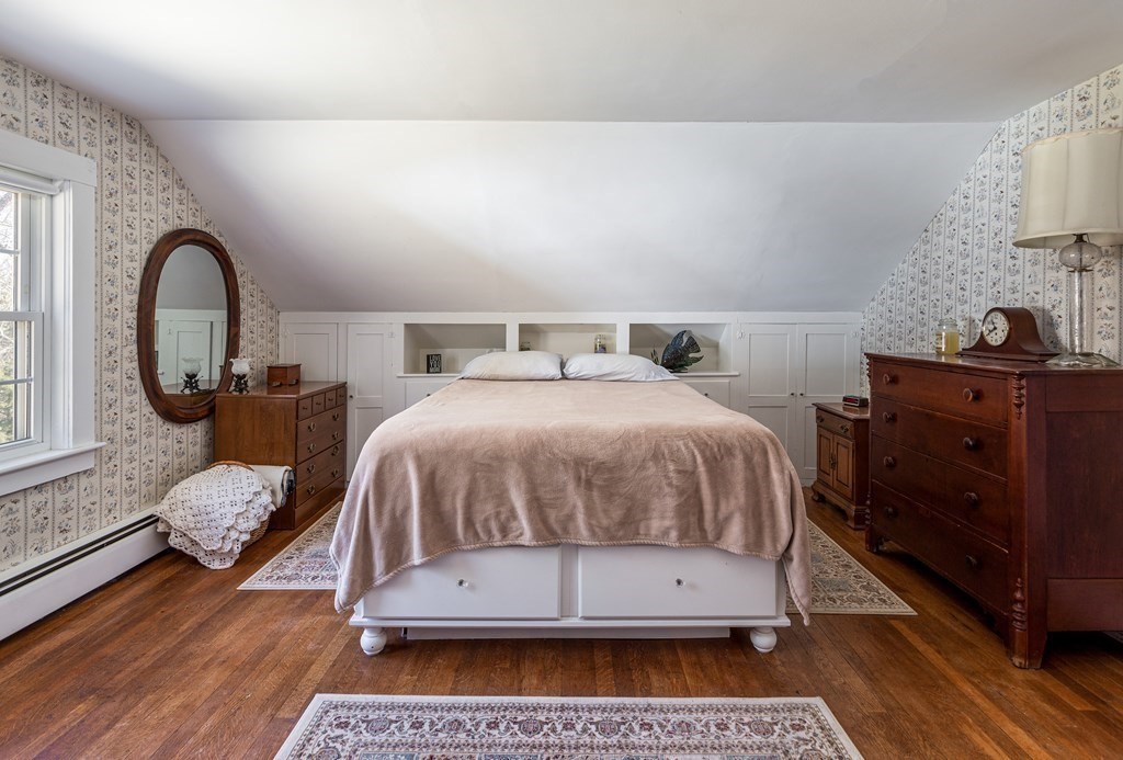 61 Ayer Road Harvard, MA 01451 - Photo 26 of 32 a bedroom with a bed a mirror and dresser