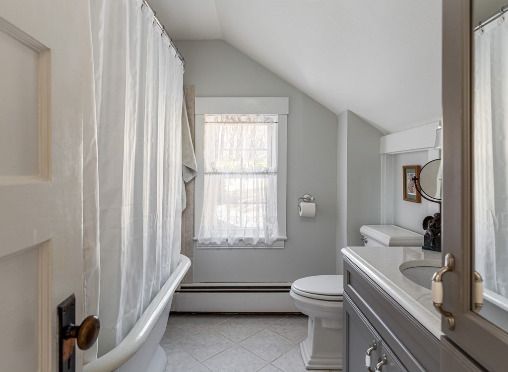 61 Ayer Road Harvard, MA 01451 - Photo 30 of 32 a bathroom with a toilet a sink and a window