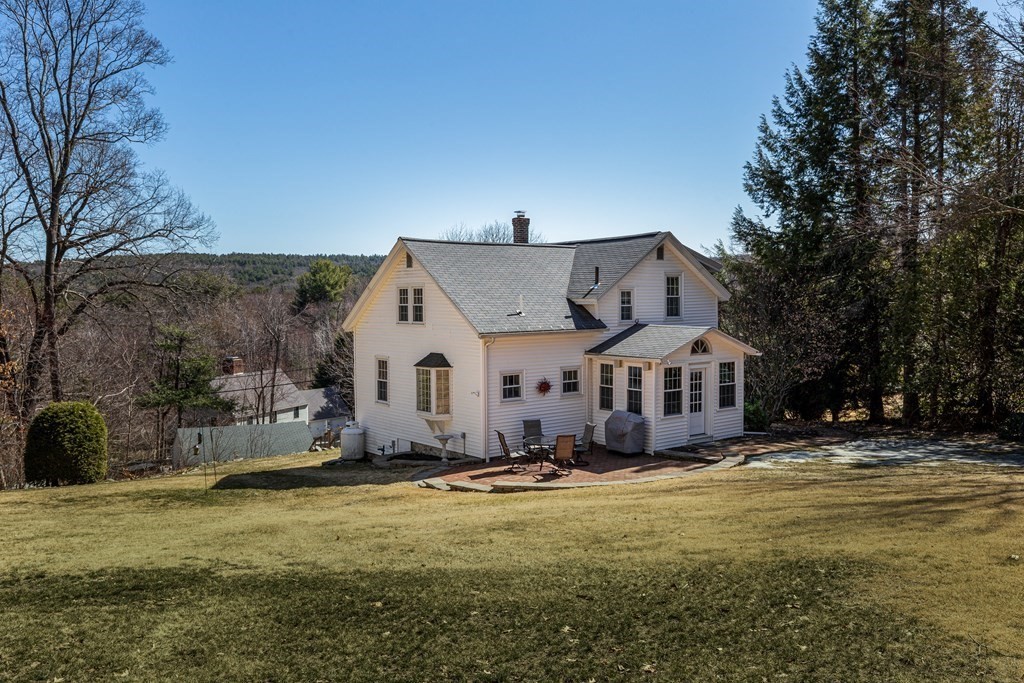 61 Ayer Road Harvard, MA 01451 - Photo 3 of 32 a front view of a house with a yard