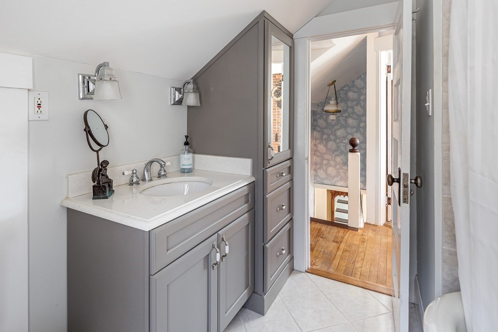61 Ayer Road Harvard, MA 01451 - Photo 31 of 32 a bathroom with a sink a mirror and a shower
