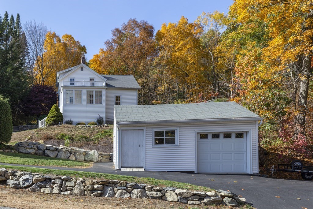61 Ayer Road Harvard, MA 01451 - Photo 7 of 32 front view of a house with a tree