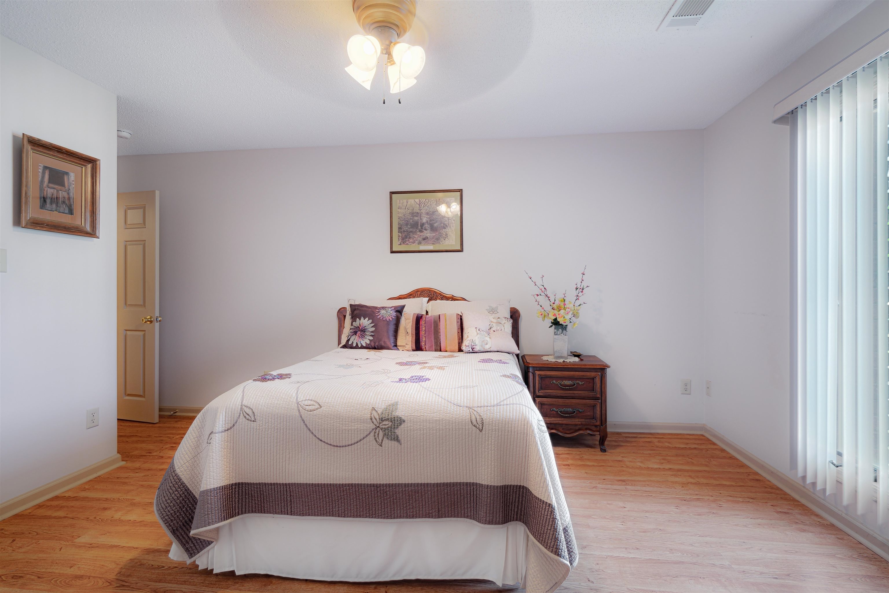 7063 Cutter Mill Road Memphis, TN 38141 - Photo 21 of 29 Bedroom featuring ceiling fan, baseboards, visible vents, and light wood-type flooring