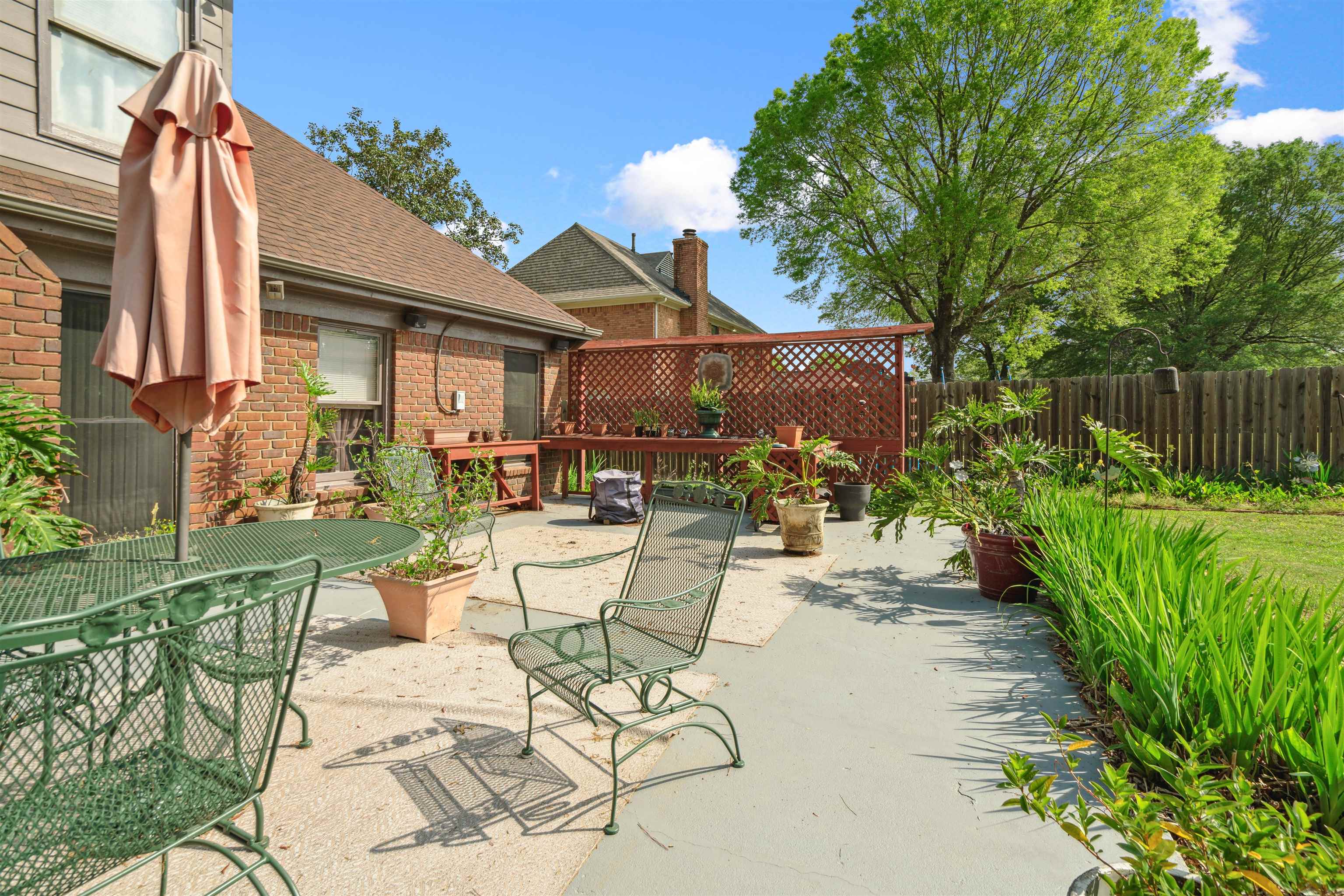 7063 Cutter Mill Road Memphis, TN 38141 - Photo 27 of 29 View of patio / terrace with a fenced backyard and outdoor dining area