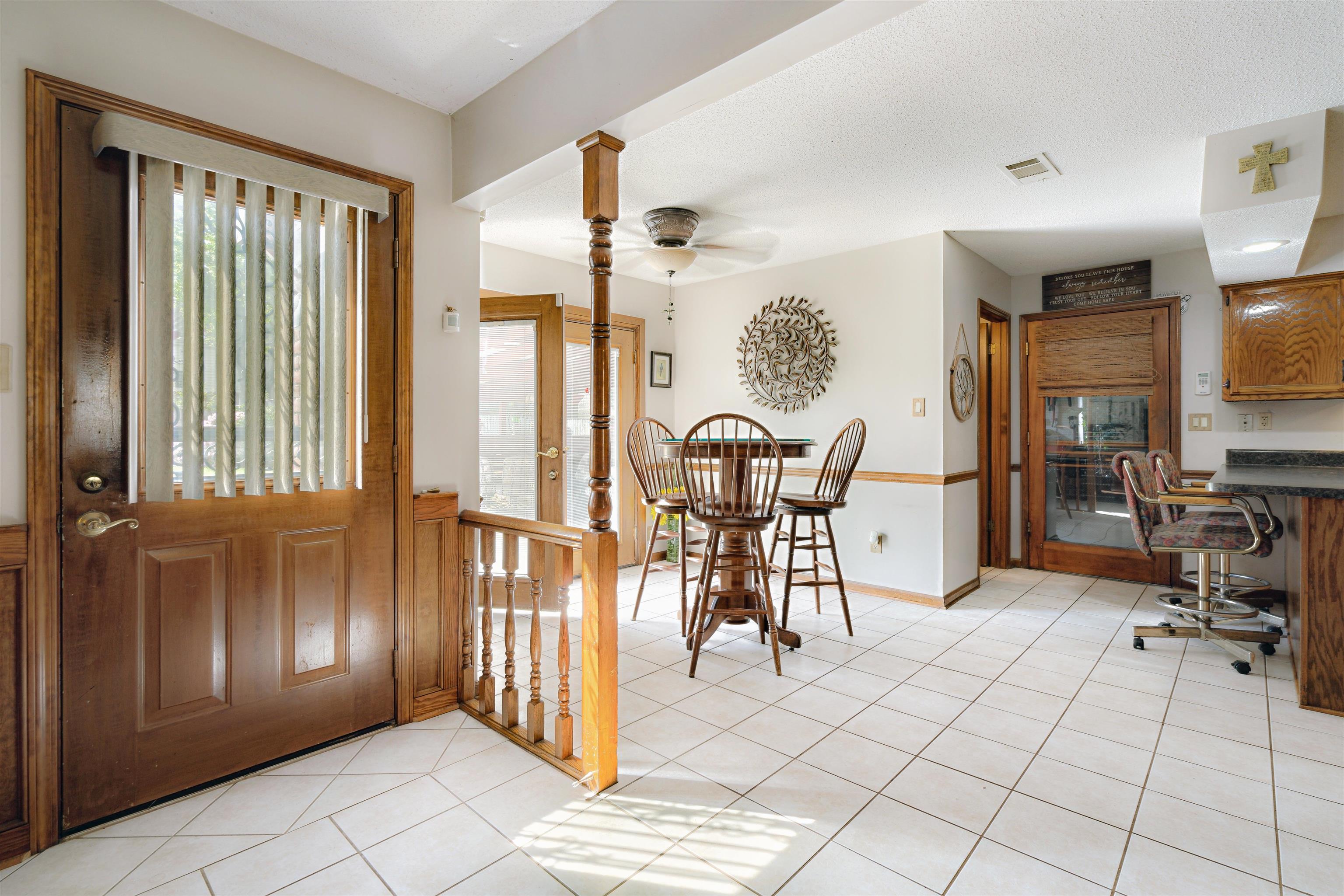 7063 Cutter Mill Road Memphis, TN 38141 - Photo 4 of 29 Entrance foyer with visible vents, a ceiling fan, baseboards, and light tile patterned floors