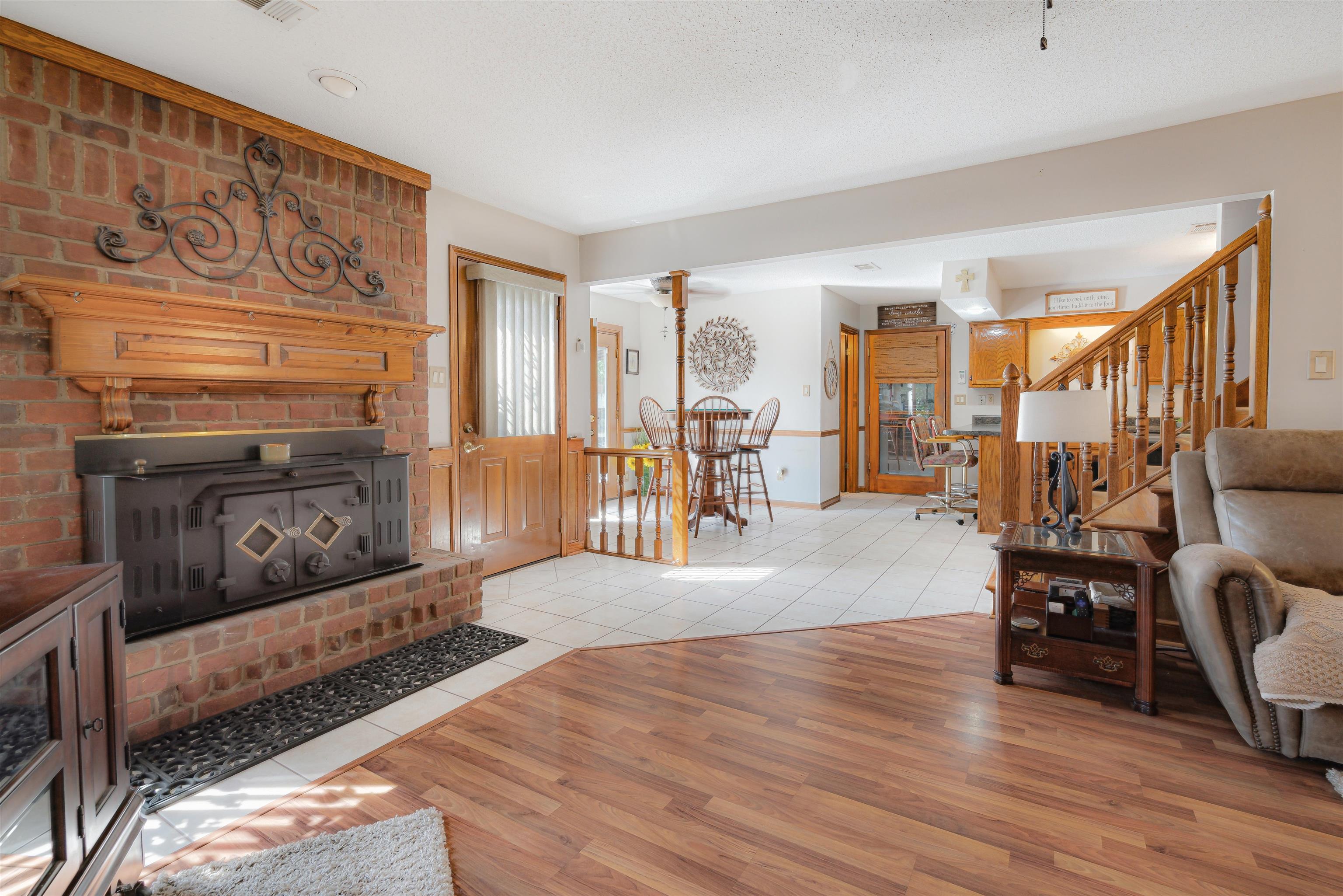 7063 Cutter Mill Road Memphis, TN 38141 - Photo 6 of 29 Great Room with wood finished floors, a textured ceiling, baseboards, and stairway
