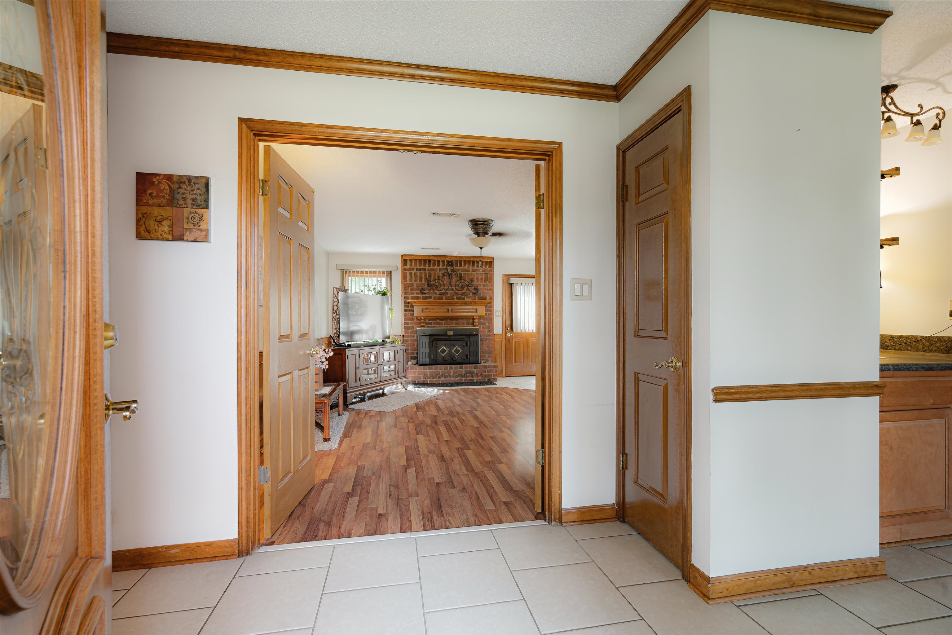 7063 Cutter Mill Road Memphis, TN 38141 - Photo 10 of 29 Hall featuring light tile patterned flooring, baseboards, and ornamental molding