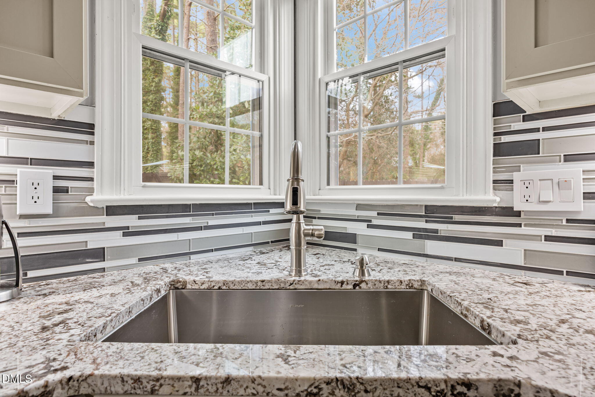 6313 Ashley Ridge Drive Raleigh, NC 27612 - Photo 11 of 41 a kitchen with granite countertop a sink and a counter top space