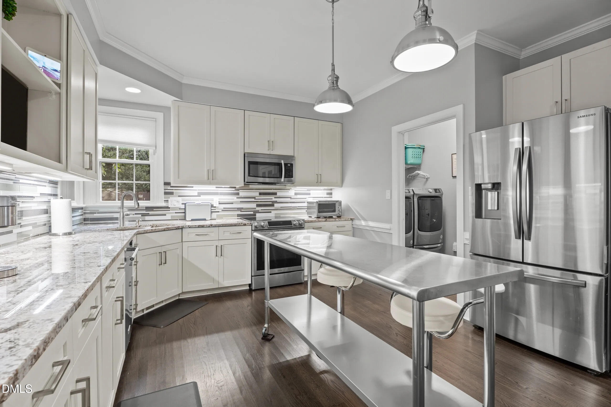 6313 Ashley Ridge Drive Raleigh, NC 27612 - Photo 13 of 41 a kitchen with appliances cabinets and a sink