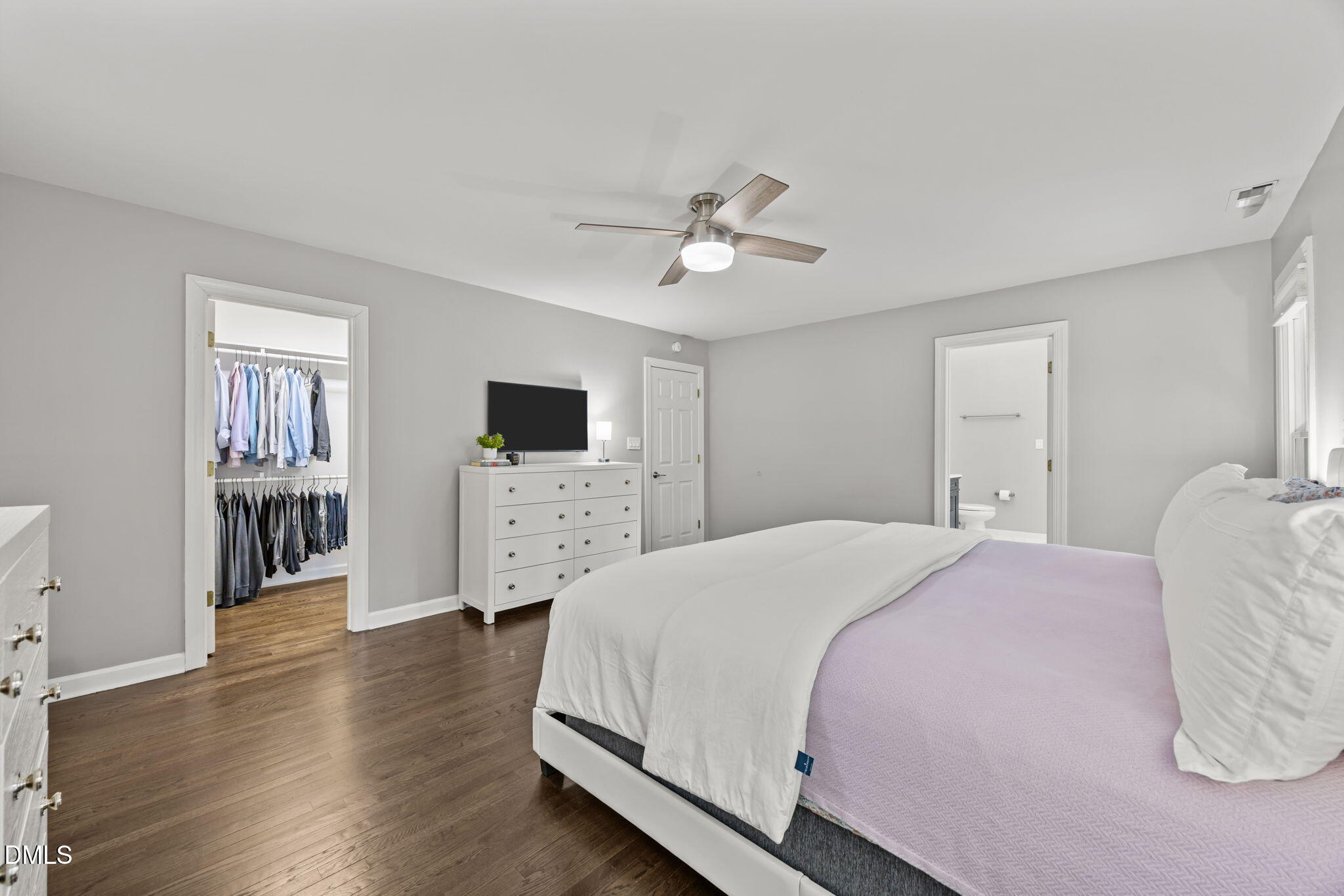 6313 Ashley Ridge Drive Raleigh, NC 27612 - Photo 20 of 41 a spacious bedroom with a bed and a flat screen tv