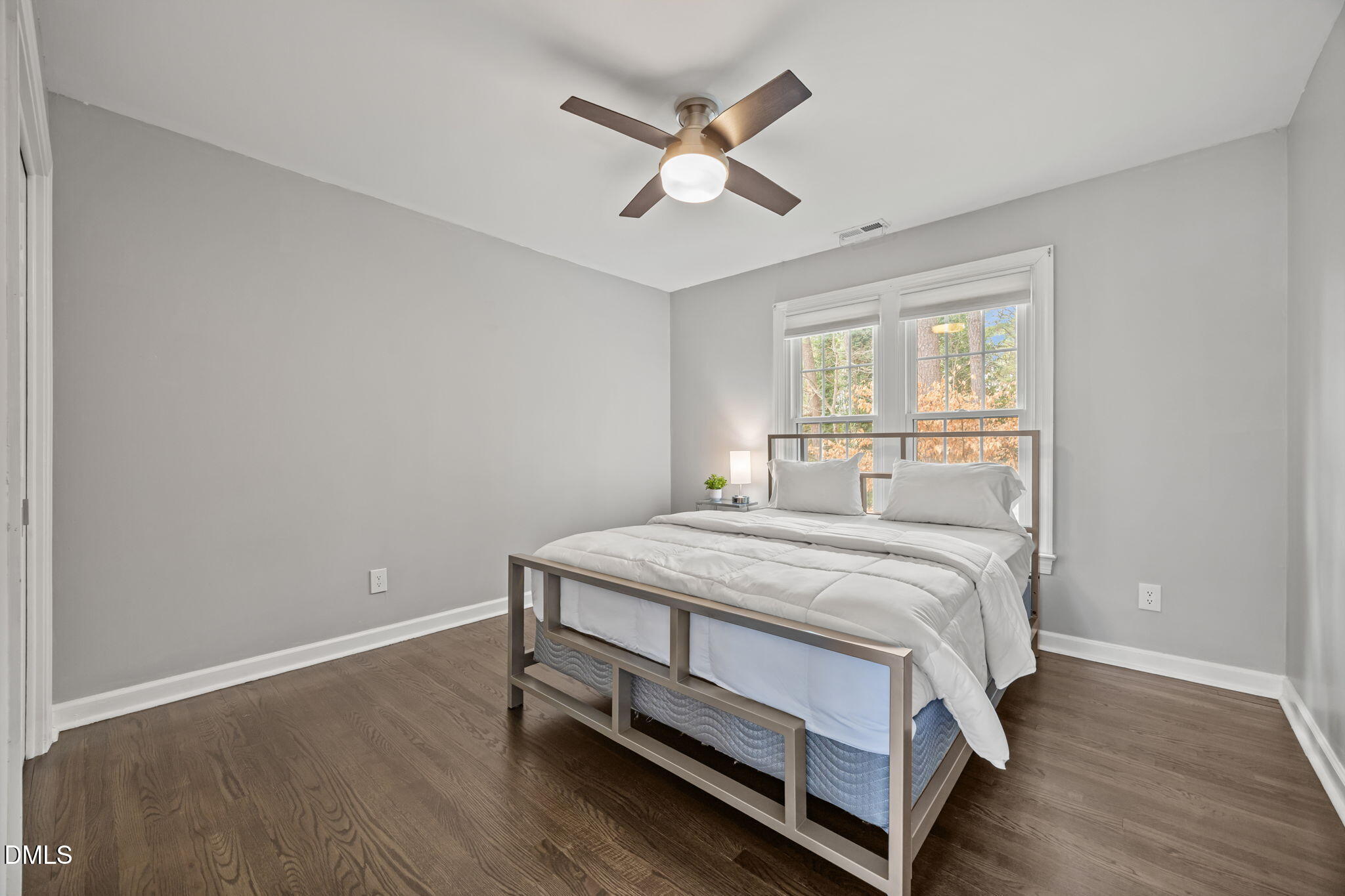 6313 Ashley Ridge Drive Raleigh, NC 27612 - Photo 23 of 41 a bedroom with a bed and a ceiling fan