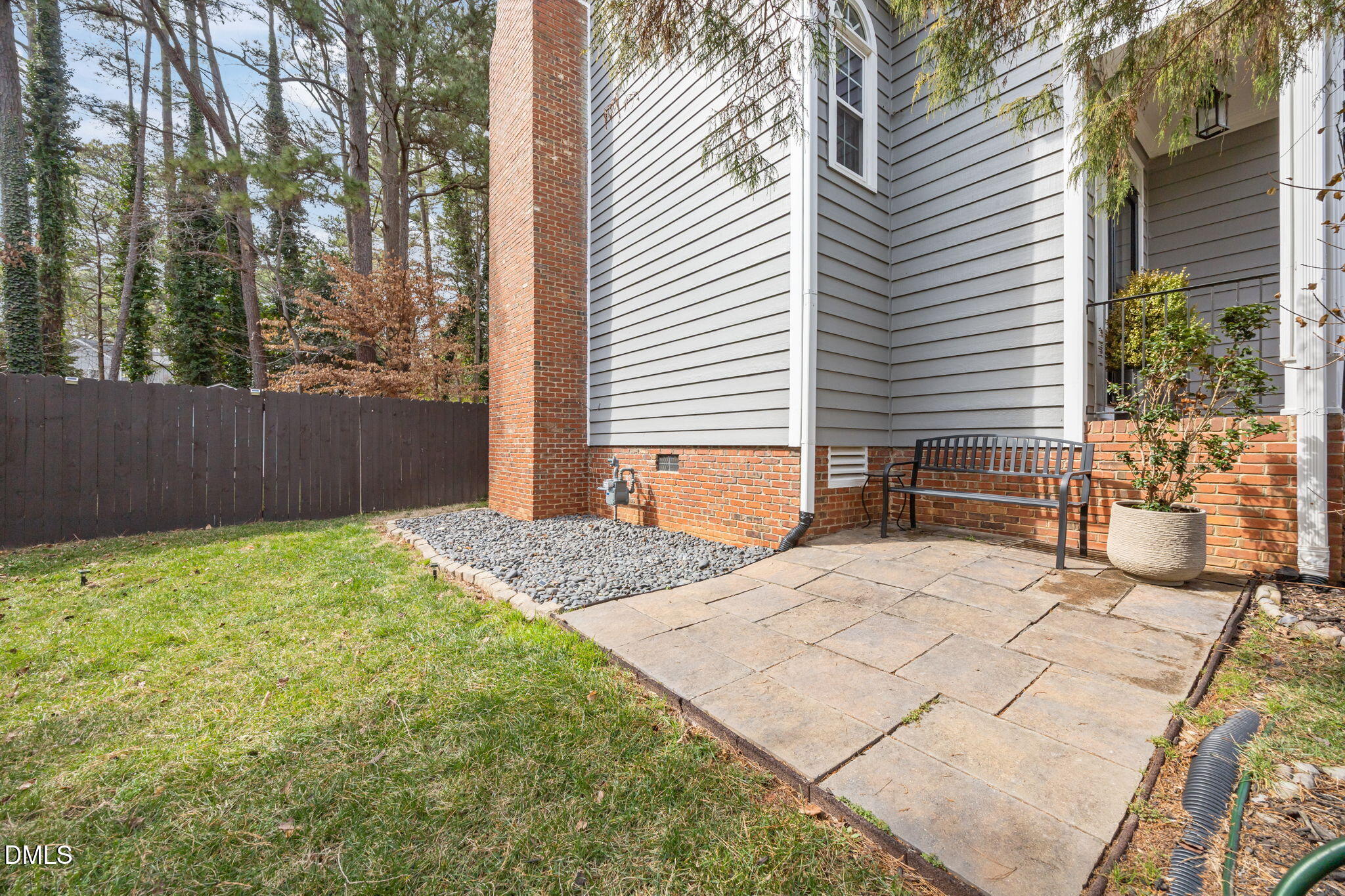 6313 Ashley Ridge Drive Raleigh, NC 27612 - Photo 34 of 41 a backyard of a house with table and chairs