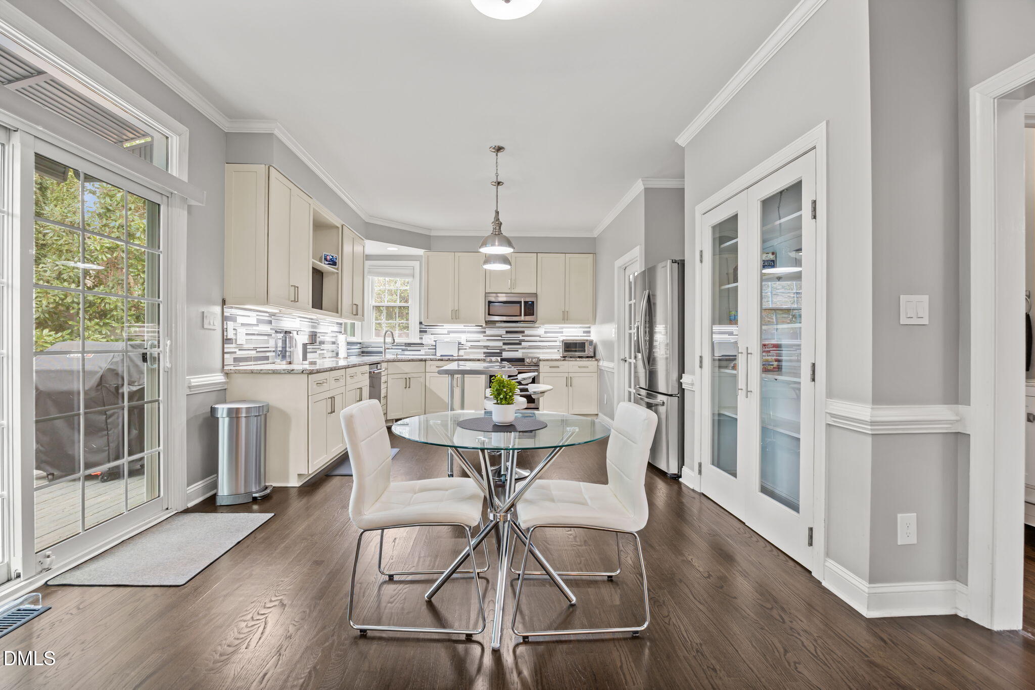 6313 Ashley Ridge Drive Raleigh, NC 27612 - Photo 9 of 41 a view of a dining room with furniture window and wooden floor