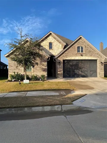 a view of a house with a large space and a yard