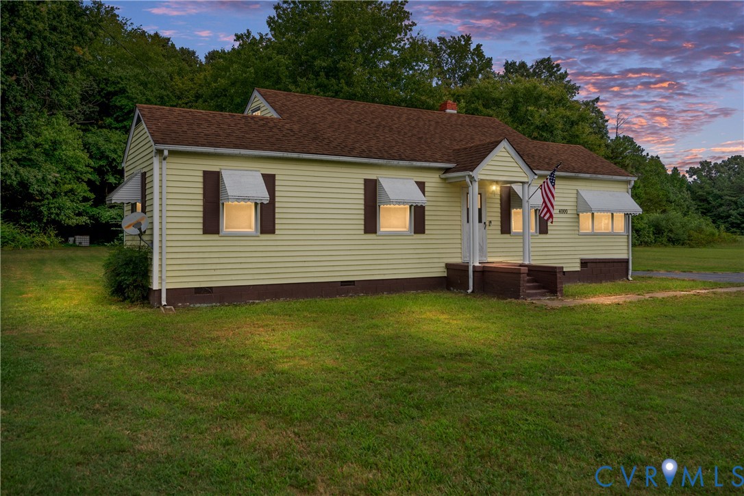 4000 Wayside Road Charles City, VA 23030 - Photo 2 of 30 Yellow siding exterior with a brown roof and match