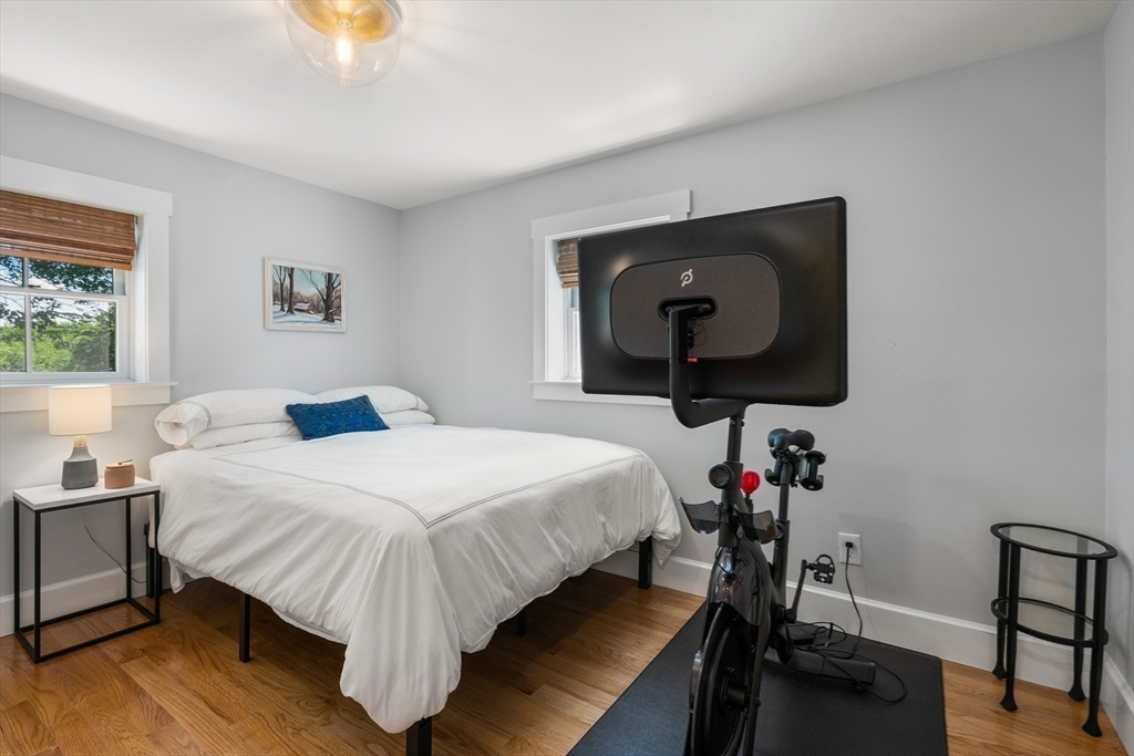 36 Autumn Circle Canton, MA 02021 - Photo 13 of 32 a bedroom with a bed and a potted plant