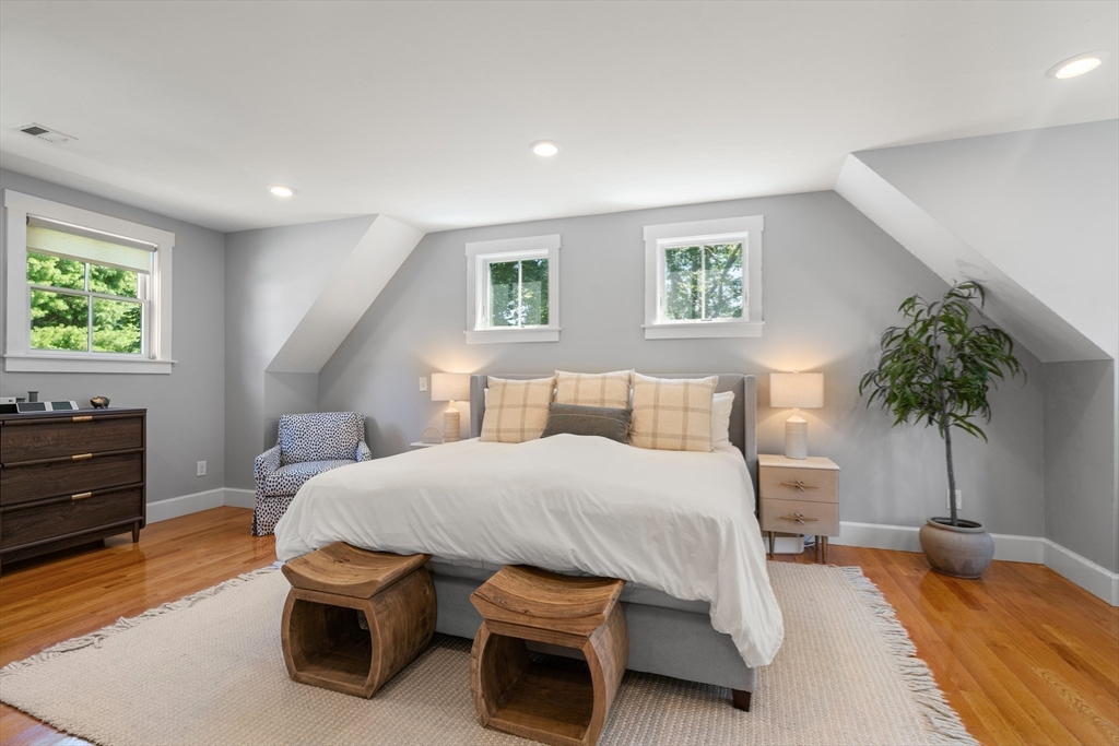 36 Autumn Circle Canton, MA 02021 - Photo 16 of 32 a bedroom with a bed and a potted plant