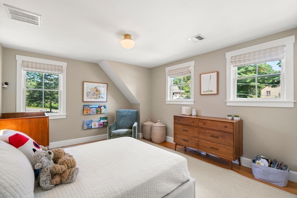 36 Autumn Circle Canton, MA 02021 - Photo 21 of 32 a bedroom with a bed dresser and a window