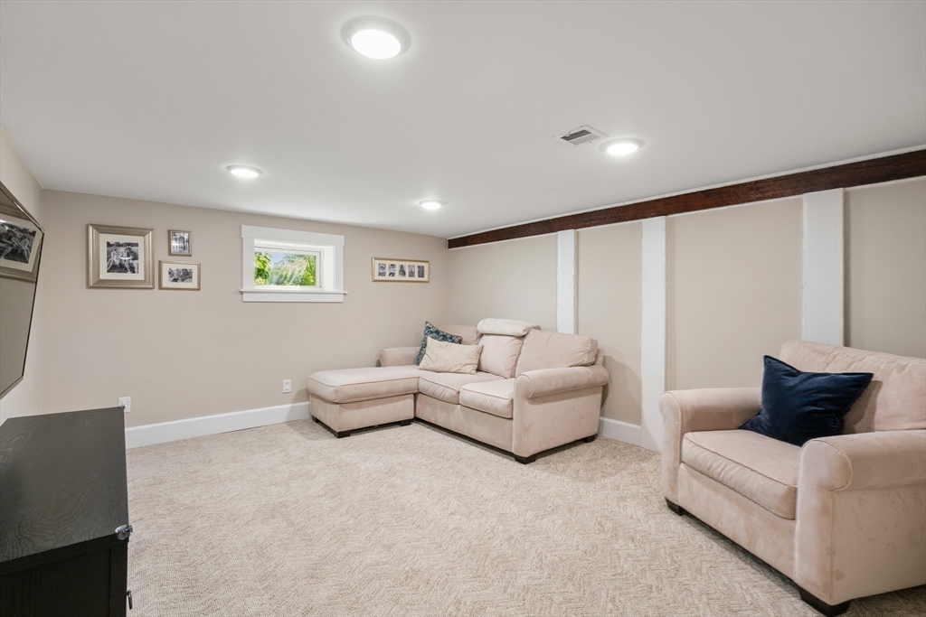 36 Autumn Circle Canton, MA 02021 - Photo 23 of 32 a living room with furniture and a large window