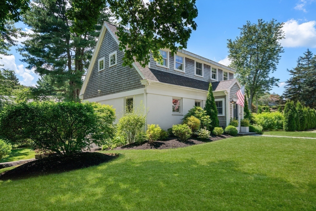 36 Autumn Circle Canton, MA 02021 - Photo 28 of 32 a front view of a house with a garden