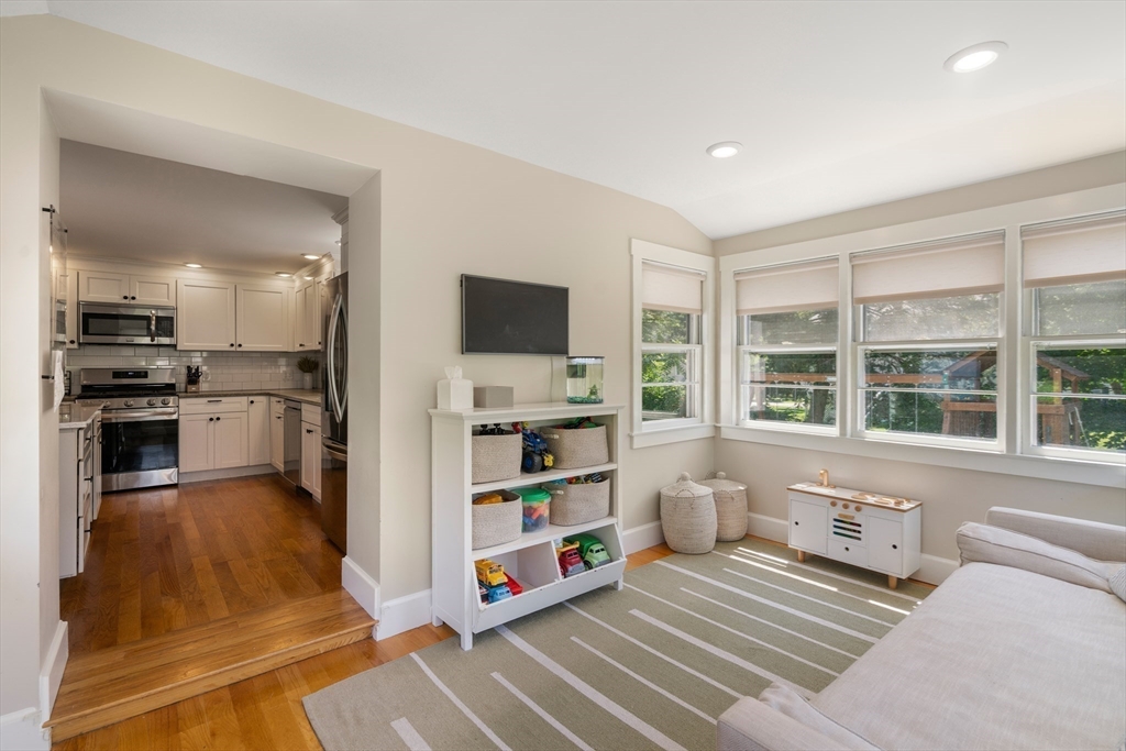 36 Autumn Circle Canton, MA 02021 - Photo 10 of 32 a living room with stainless steel appliances furniture a flat screen tv and a kitchen view