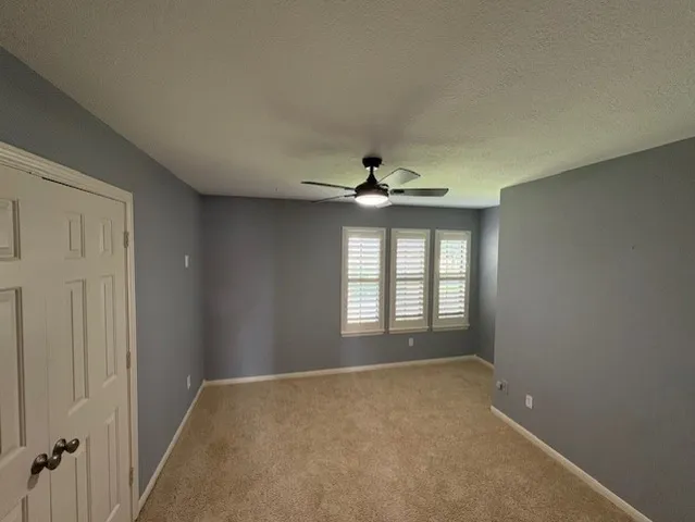 a spacious bathroom with a double vanity sink and a mirror