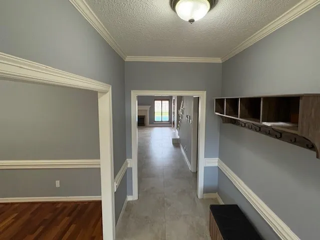 a view of a hallway view with wooden floor and staircase