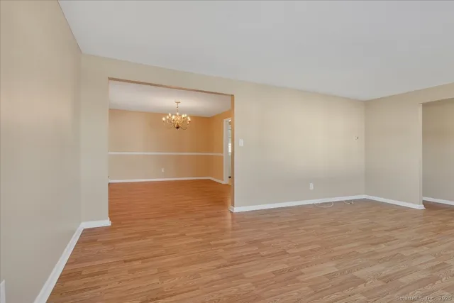 a view of wooden floor and staircase in a room
