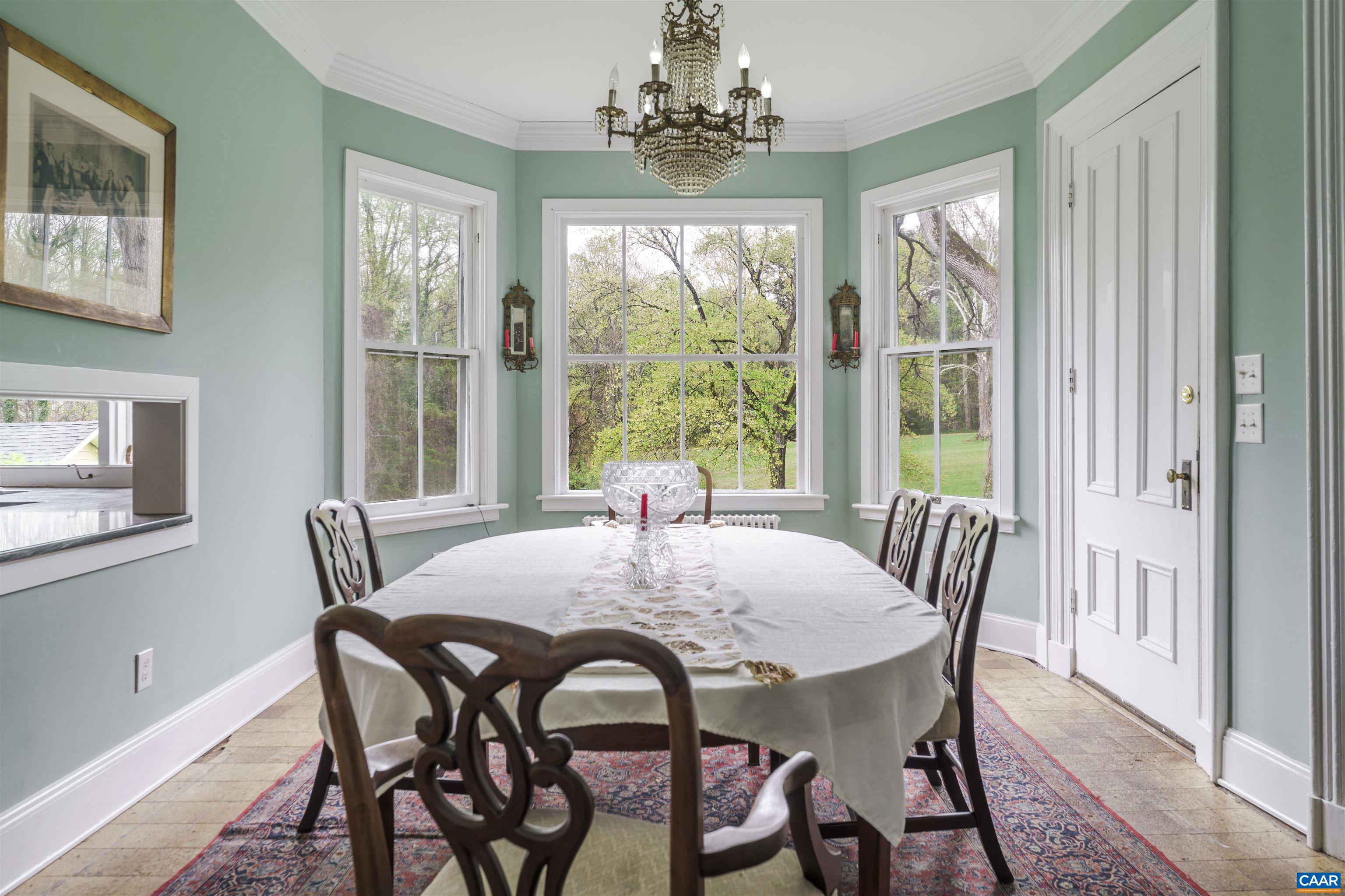5515 Gordonsville Road Keswick, VA 22947 - Photo 11 of 46 a view of a dining room with furniture window and outside view