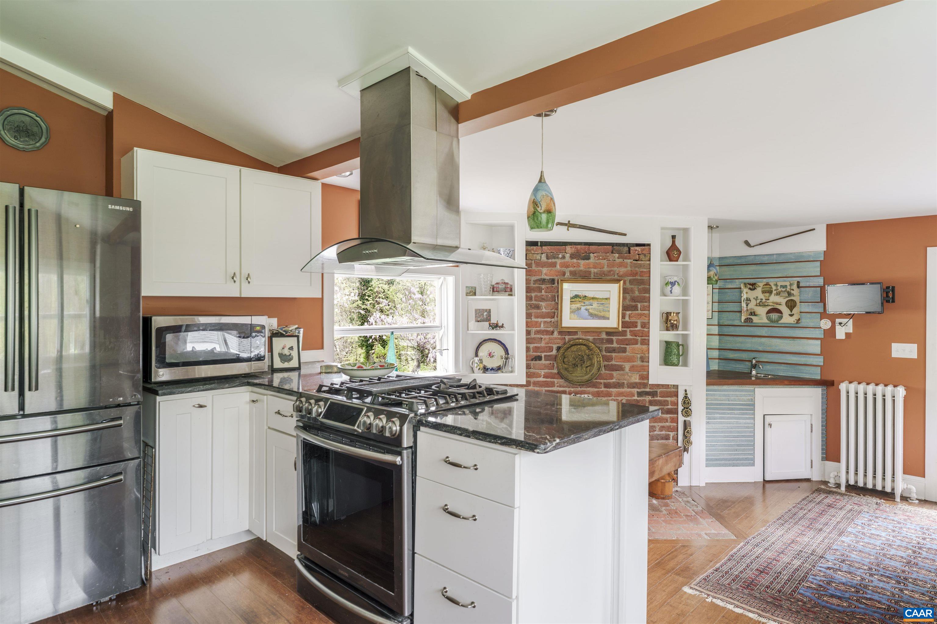 5515 Gordonsville Road Keswick, VA 22947 - Photo 14 of 46 a kitchen with stainless steel appliances a stove sink and refrigerator
