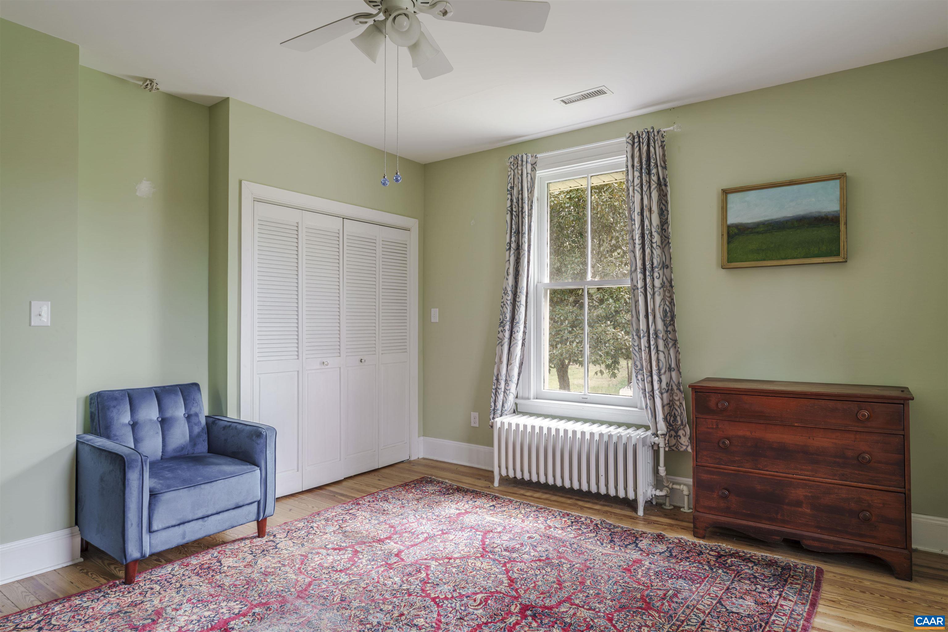 5515 Gordonsville Road Keswick, VA 22947 - Photo 20 of 46 a living room with furniture and a window