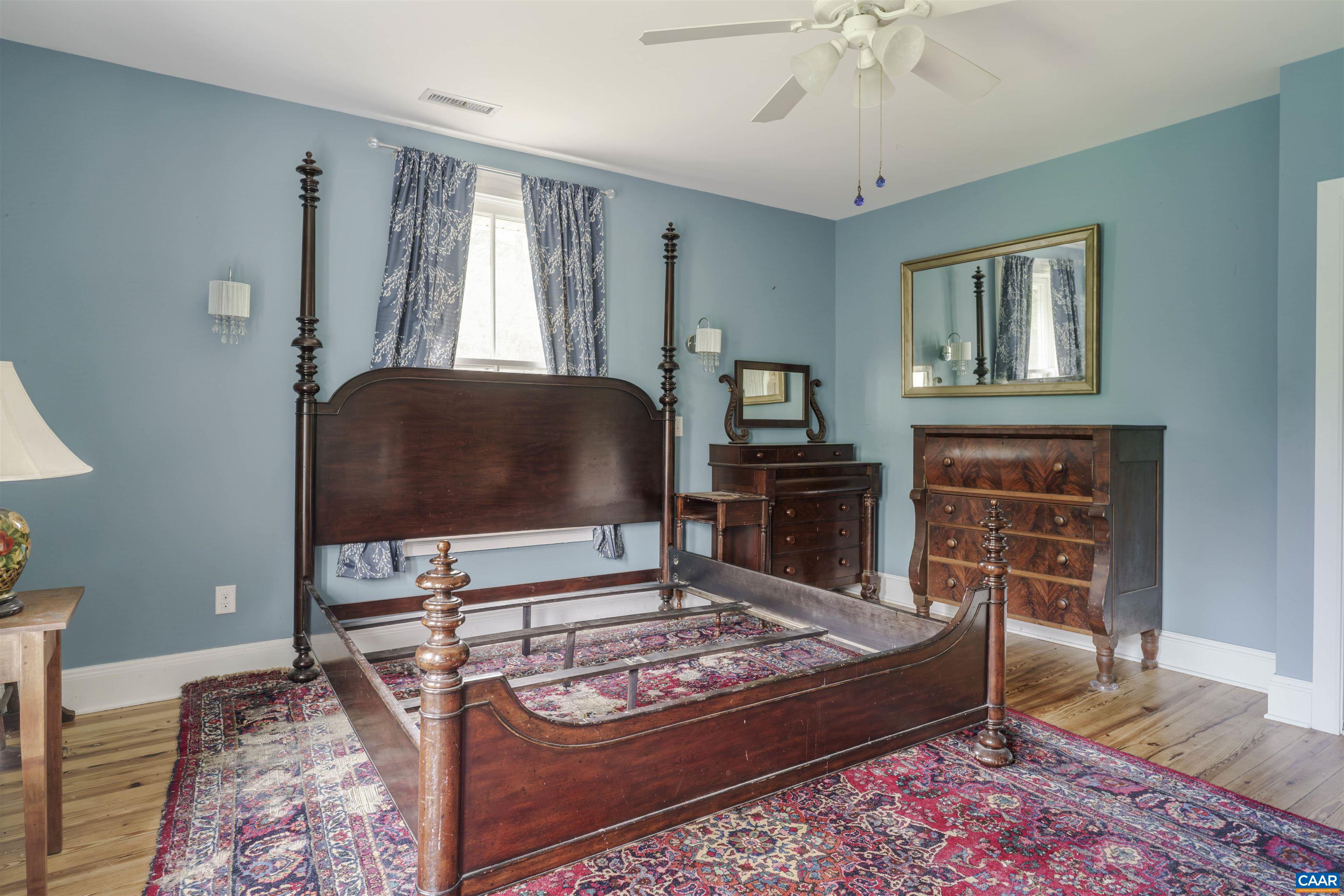 5515 Gordonsville Road Keswick, VA 22947 - Photo 21 of 46 a living room with furniture and a fireplace