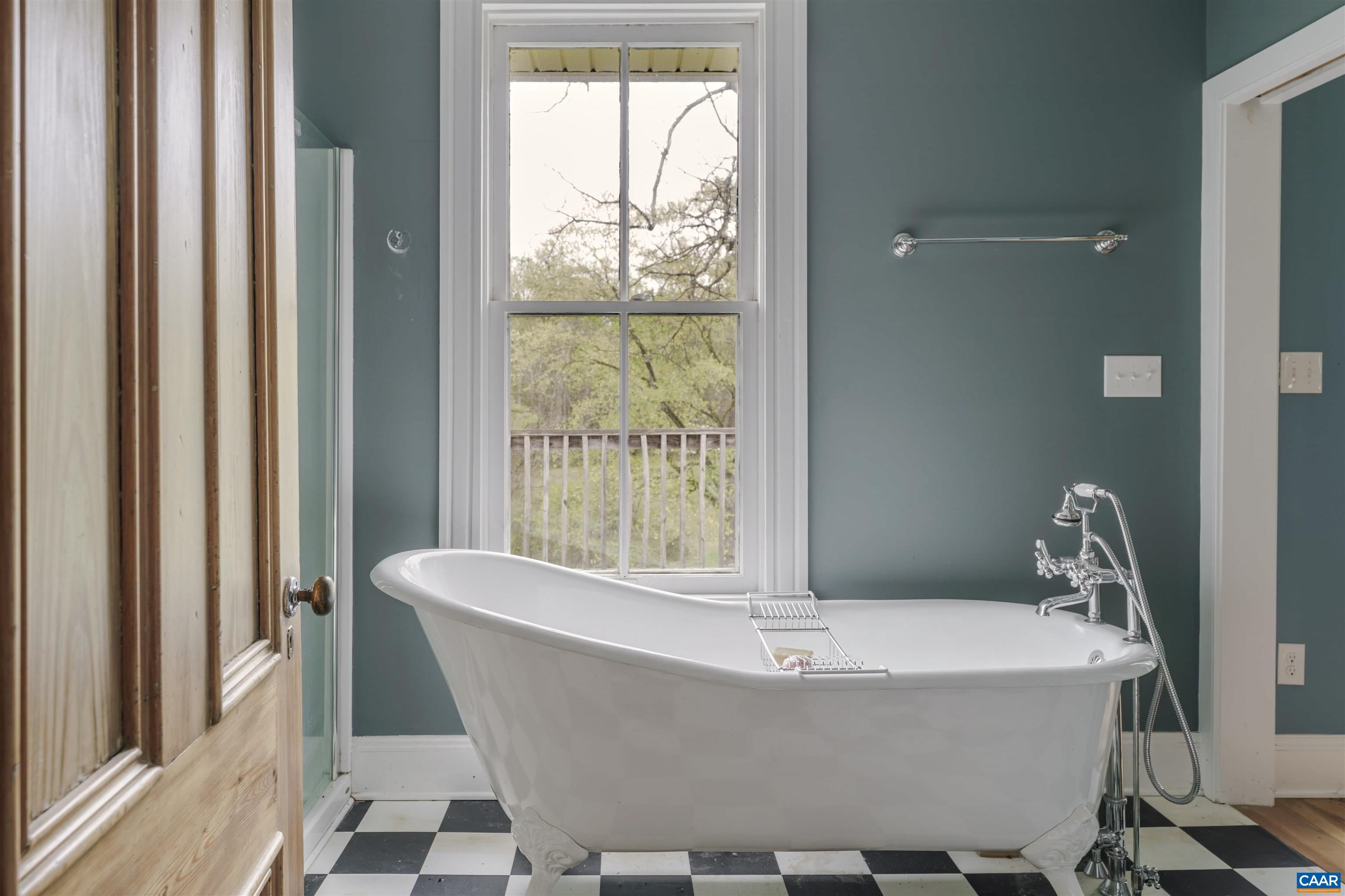 5515 Gordonsville Road Keswick, VA 22947 - Photo 23 of 46 a bath tub sitting in a bathroom next to a window