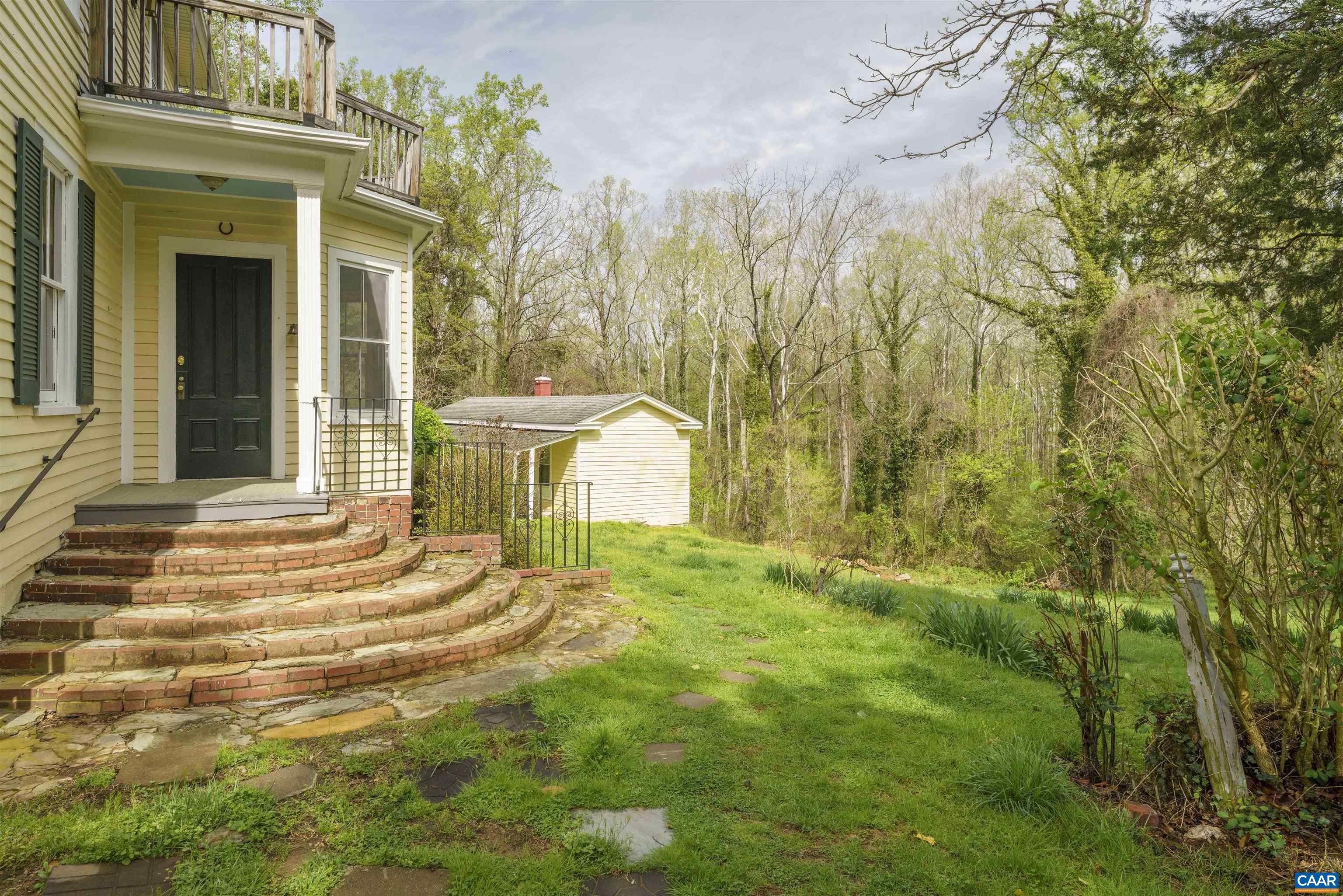 5515 Gordonsville Road Keswick, VA 22947 - Photo 25 of 46 a view of a house with a backyard and a patio