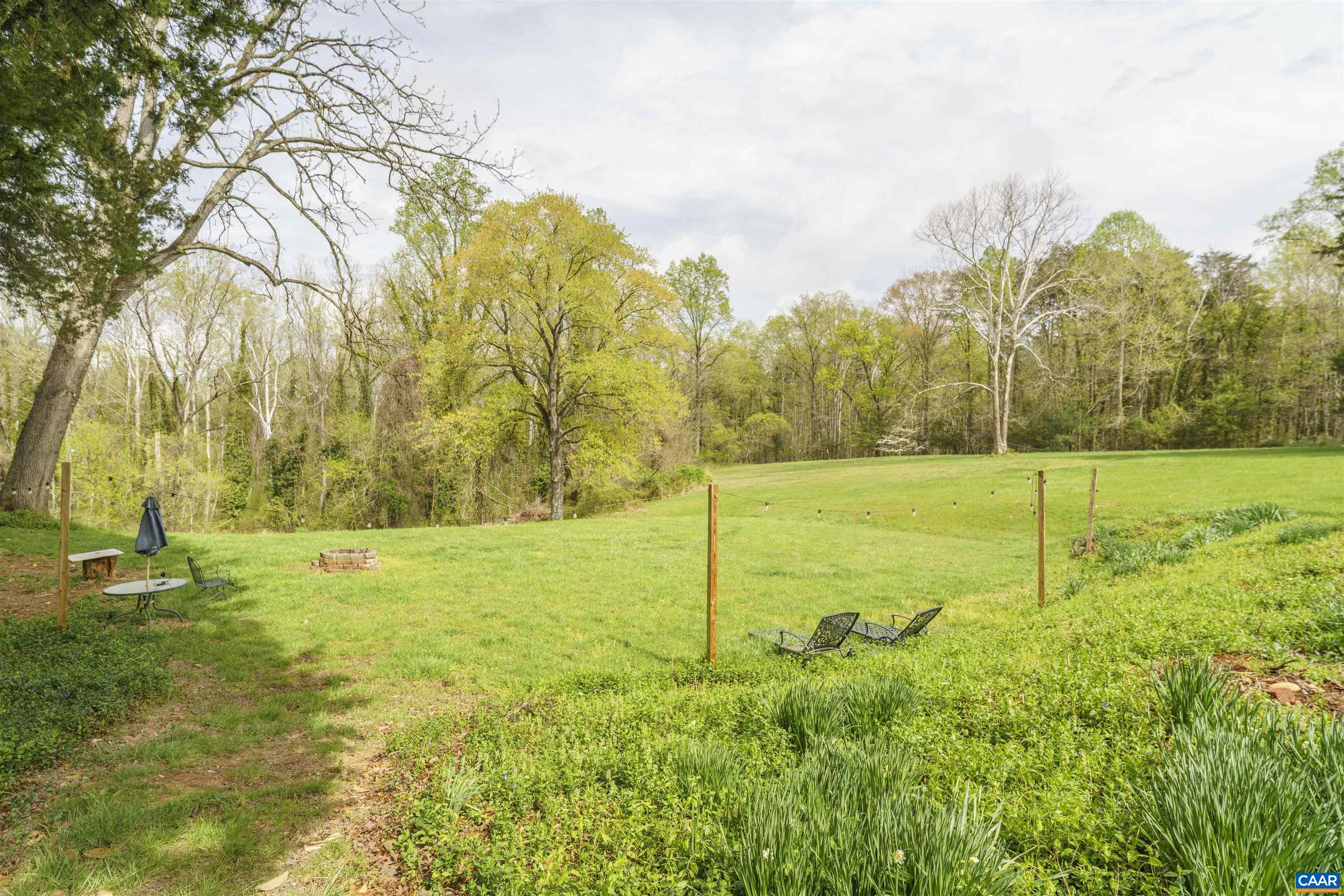 5515 Gordonsville Road Keswick, VA 22947 - Photo 26 of 46 a view of a field with an trees