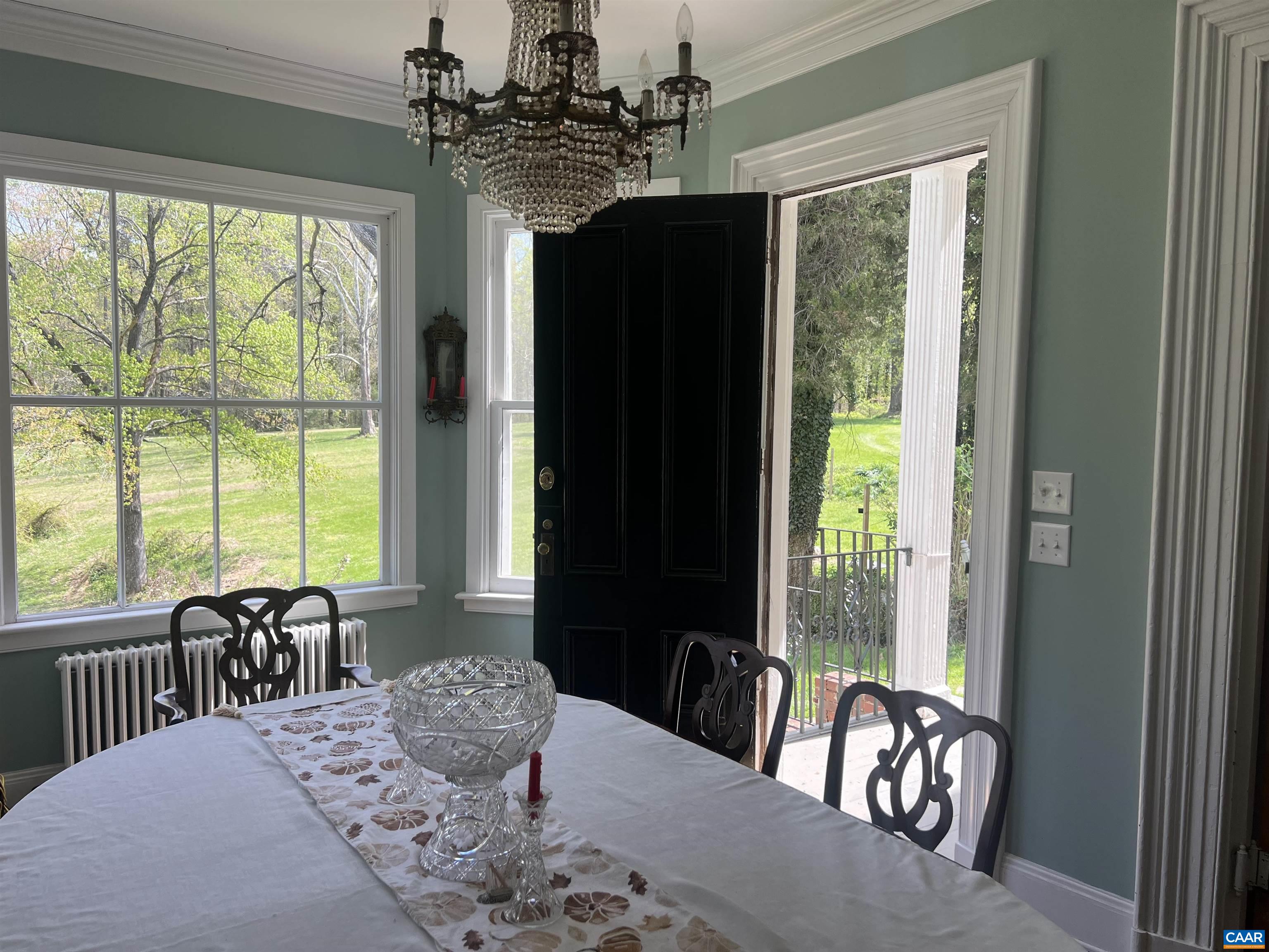 5515 Gordonsville Road Keswick, VA 22947 - Photo 40 of 46 a view of a dining room with furniture window and outside view