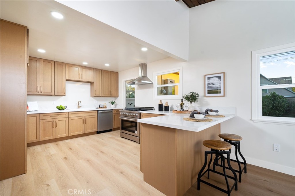 838 East Ada Avenue Glendora, CA 91741 - Photo 14 of 48 a kitchen with a sink cabinets and wooden floor
