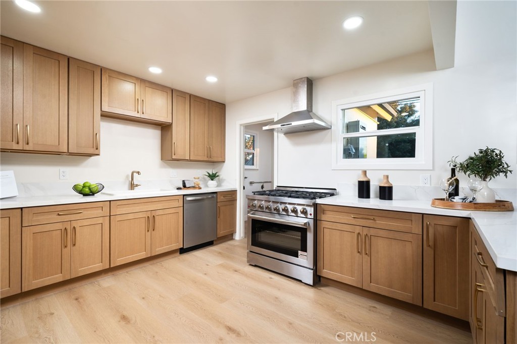 838 East Ada Avenue Glendora, CA 91741 - Photo 15 of 48 a large kitchen with stainless steel appliances granite countertop a sink and cabinets