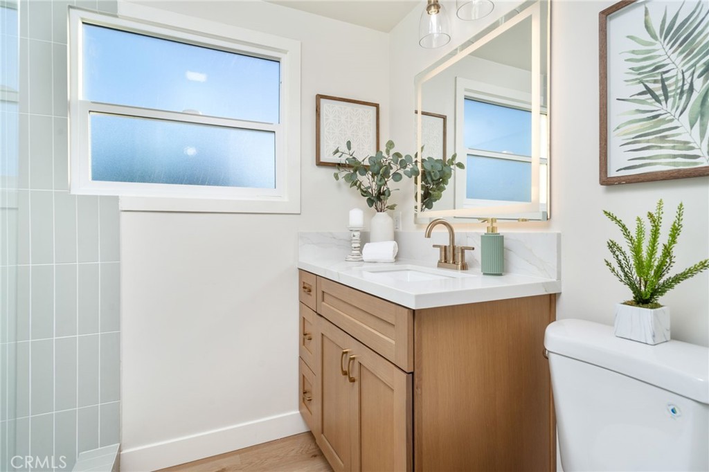 838 East Ada Avenue Glendora, CA 91741 - Photo 23 of 48 a bathroom with a sink a vanity and a mirror