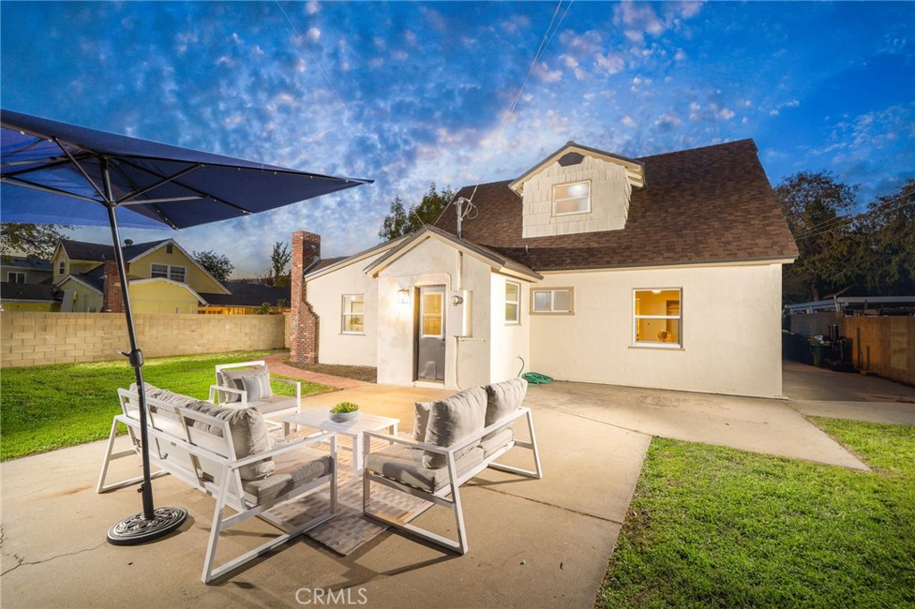 838 East Ada Avenue Glendora, CA 91741 - Photo 26 of 48 a view of a patio with a table and chairs under an umbrella