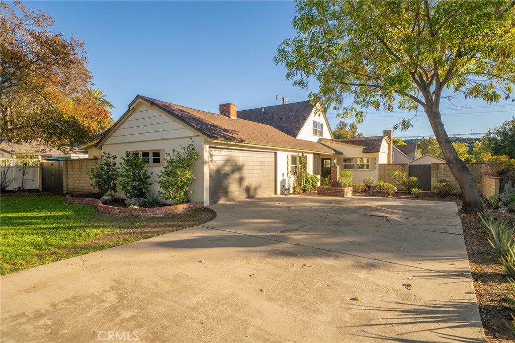 838 East Ada Avenue Glendora, CA 91741 - Photo 3 of 48 a front view of a house with a garden and tree