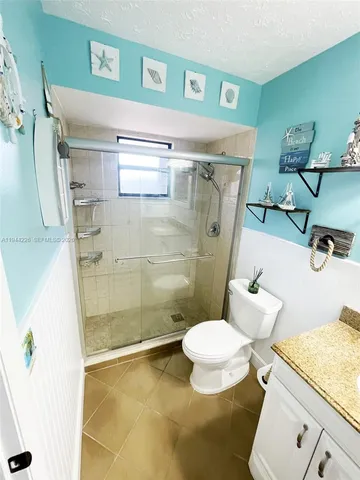 a living room with furniture a rug and a table