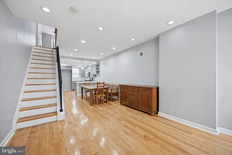 a view of an empty room with stairs