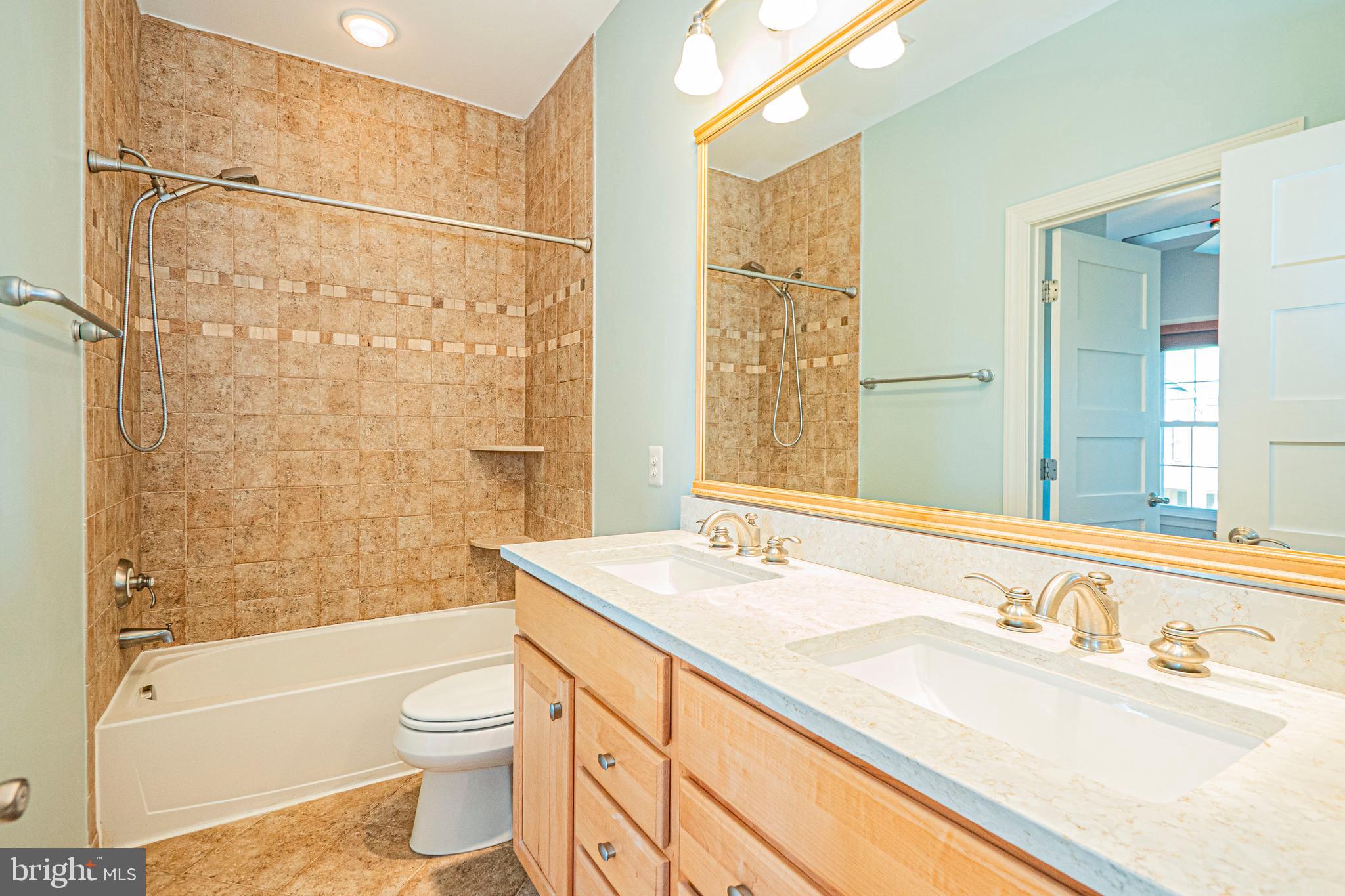 5448 Edsall Ridge Place Alexandria, VA 22312 - Photo 33 of 52 a bathroom with a sink vanity granite toilet tub and shower