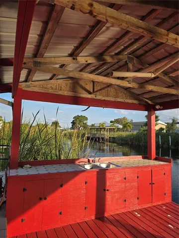 a view of swimming pool with an outdoor seating