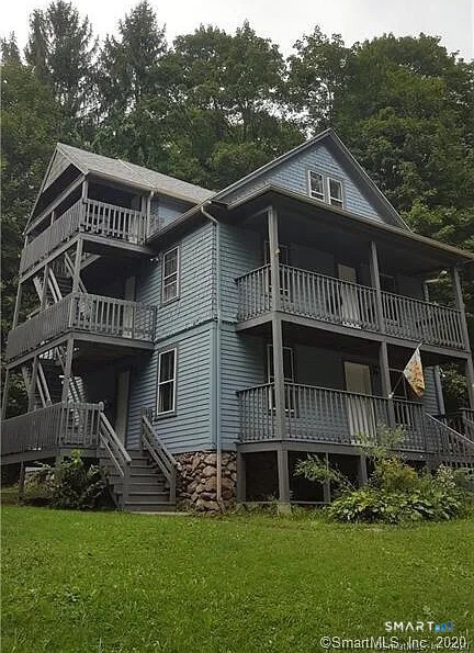 5 Brookside Avenue Winchester, CT 06098 - Photo 2 of 7 a front view of a house with a garden