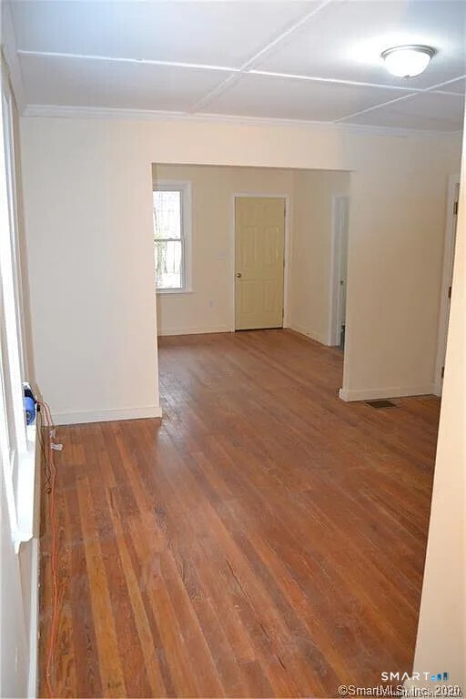 5 Brookside Avenue Winchester, CT 06098 - Photo 5 of 7 an empty room with wooden floor and windows