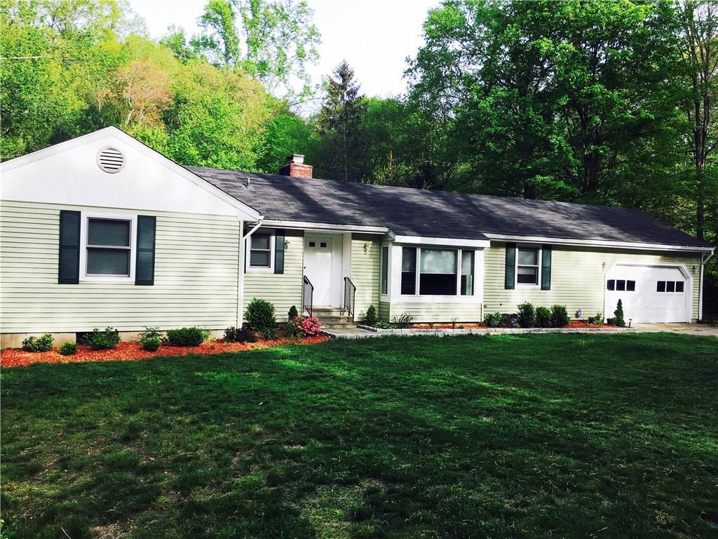 1329 Riverbank Road Stamford, CT 06903 - Photo 1 of 1 a front view of house with yard and green space